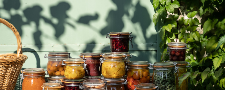 clip-top jars filled with preserves on a kitchen table