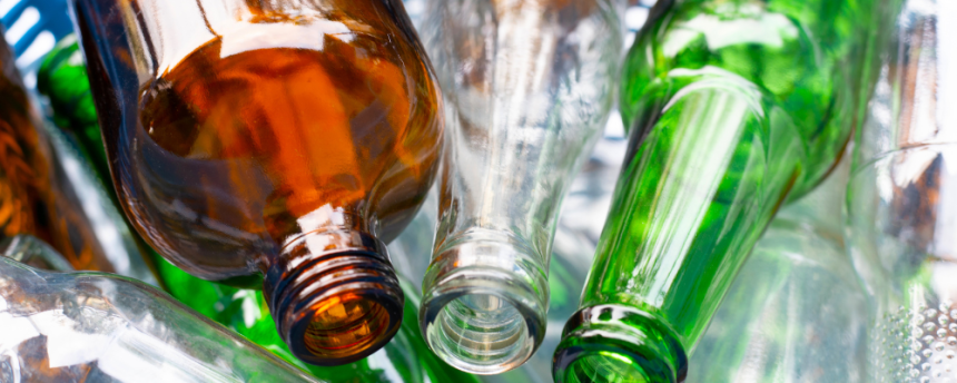 cider bottles of various colours grouped together for comarison