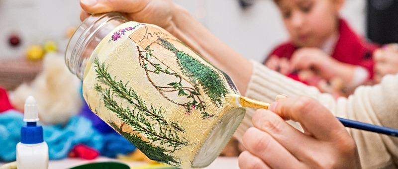 A glass jr being decoupaged