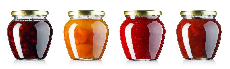collection of fruits jam in glass jars with shiny metallic lids